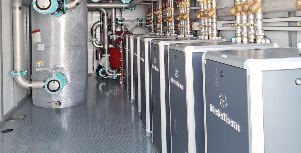 School with heat pumps installed in a container
