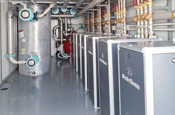 School with heat pumps installed in a container